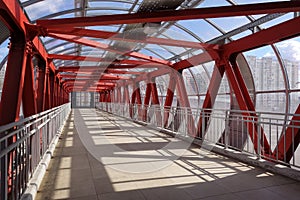 Overhead passage. Bolted steel beams. Painted in red. Interior