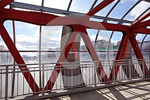 Overhead passage. Bolted steel beams. Painted in red. Interior