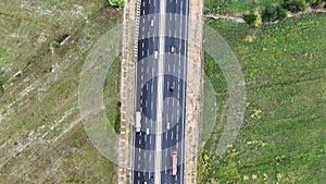 An overhead perspective of a highway featuring two lanes for vehicles to travel. The road stretches into the distance