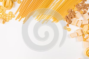 An overhead photo of different types of pasta, including spaghetti, penne, fusilli, and others