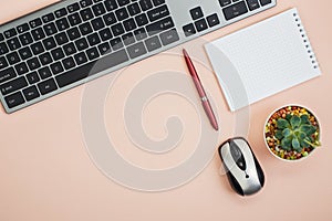 Overhead photo of keyboard pen paper