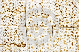 An overhead photo of many pieces of matzah or matza. Matzah for the Jewish Passover holidays. Place for text, copy space. Selectiv