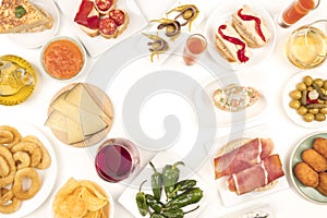 An overhead photo of Spanish tapas, forming frame on white with place for text