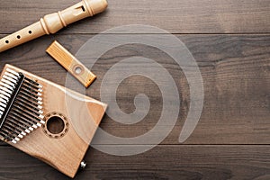 Overhead photo of wooden musical instruments with copy space