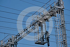 Overhead power lines against blue sky