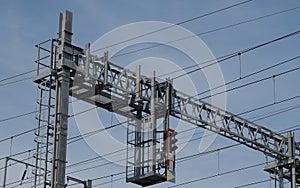 Overhead power lines against blue sky