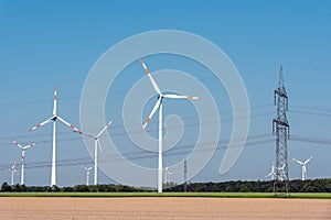 Overhead power lines and wind energy plants