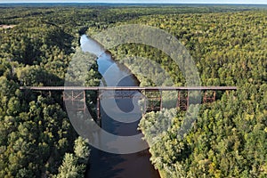 Overhead Railroad Trestle Bridge Over River and Forest