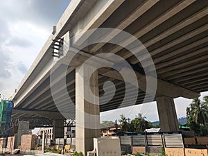 Overhead road under construction. The massive concrete column used to support the concrete road deck.