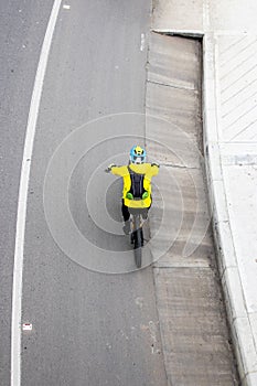 Overhead shot of an amateur male cyclist on the road between Bogota and La Calera on the mountains in Colombia photo