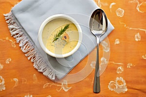 overhead shot of bisque with spoon and napkin