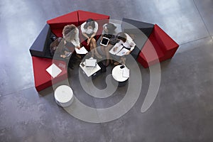 Overhead Shot Of Businesswomen Meeting In Lobby Of Office