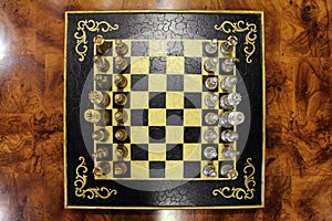 Overhead shot of a Chess Board with Chess Pieces Lined Up