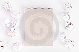 overhead shot of crumpled paper in oder and note among on white background. great idea concept