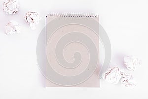overhead shot of crumpled paper in oder and note among on white background. great idea concept