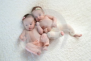 OVerhead Shot of Fraternal Twin Baby Sisters