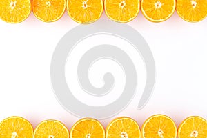 Overhead shot of oranges on white background