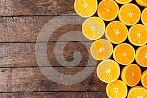 Overhead shot of oranges on wooden background