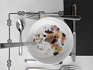 Cereals, milk and silverware