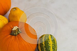 Overhead shot of pumpkins on  bright background and space for text