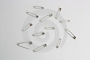 Overhead shot of sewing pins on a white background