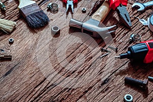 Overhead shot of variety handy construction tools  on grunge rusty wood background with copy space for your text for Worker`s day