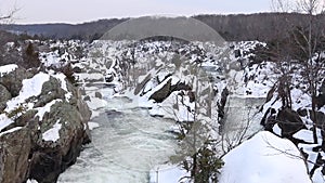 Overhead shot of winter white water waterfall with snowy rocks - Great Falls National Park