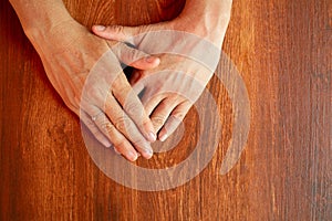 overhead shot of woman's hands with hope and family union, family concept