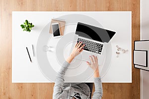 Overhead shot of woman using laptop