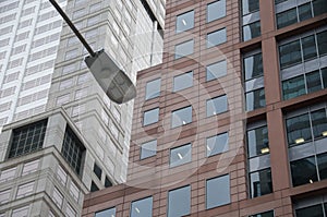 Overhead traffic lamp and modern office buildings in European city