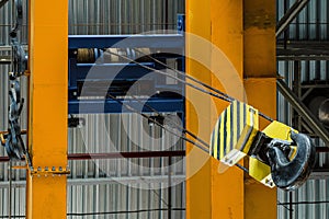 Overhead traveling crane with steel hooks in industrial engeenering plant shop