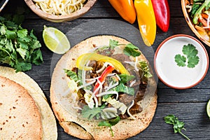 Overhead view on authentic mexican street taco with beef and veg