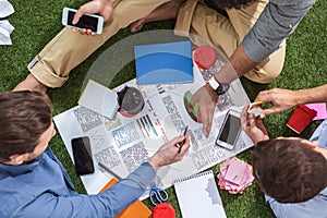 Overhead view of business people working on new business plan