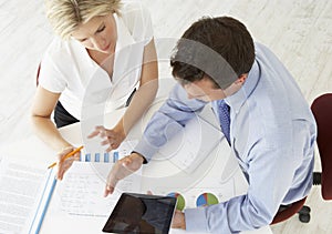 Overhead View Of Businesswoman And Businessman Working At Desk T