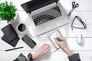 Overhead view of businesswoman working at computer in office