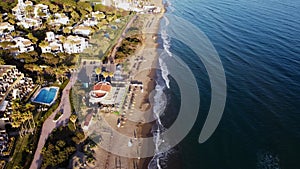 Overhead view capturing the vibrant life and luxury of a coastal resort by the serene sea, Costa Del Sol, Marbella