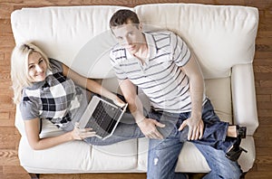Overhead View of Couple Relaxing on Couch