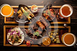 overhead view of craft beer flight with grilled dishes