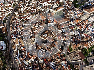 Overhead view of the curved streets and rooftops in Ojen, revealing the intricate layout of this Andalusian town