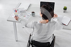 Overhead view of disabled freelancer working