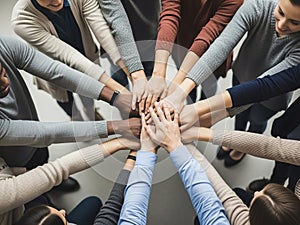Diverse team hands stacked in unity for a collaborative effort
