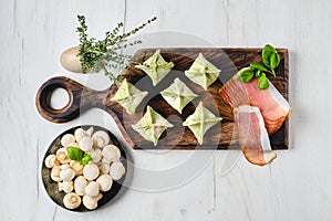 Overhead view of dumplings stuffed with smoked ham and mushrooms