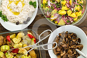 Overhead view of four savory vegetable dishes