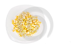 Overhead view of fresh corn maize kernels on plate