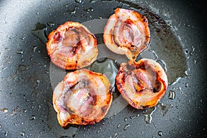 Fried Slices of Pancetta in a Nonstick Skillet photo