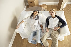 Overhead View Of Friends Moving Into New House