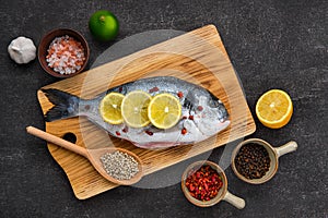 Overhead view of gilt head bream with spice prepared for cooking