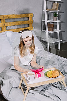 overhead view of girl opening present box