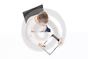 Overhead view of a handsome guy with organizer in office. Business and office concept