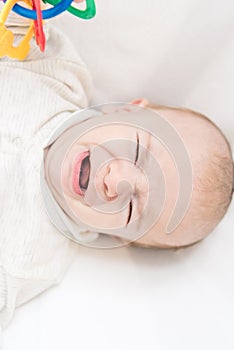 Overhead view of little crying baby